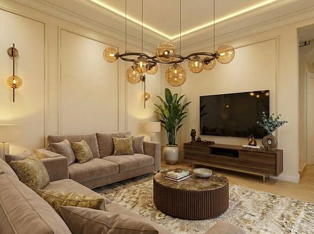 Wnętrze salonu w tradycyjnym stylu z beżowymi sofami, brązowym stolikiem i nowoczesnym oświetleniem.