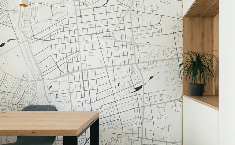 Wnętrze jadalnii w stylu minimalistycznym i skandynawskim z mapą i rośliną