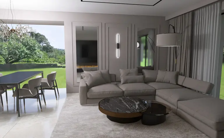 Wnętrze salonu z szarym narożnikiem, czarnym stolikiem oraz dużymi oknami w stylu quiet luxury.