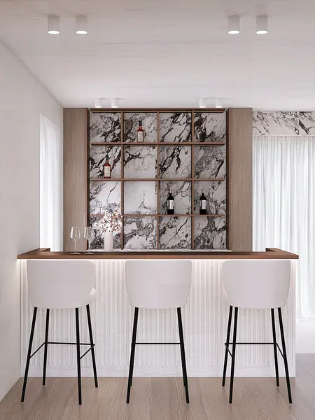 Nowoczesny bar w stylu quiet luxury z białymi stołkami i marmurowym tłem.