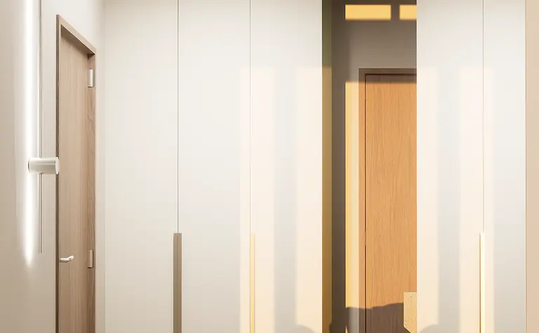 Przedpokój w stylu japandi z białymi meblami i minimalistycznym oświetleniem.