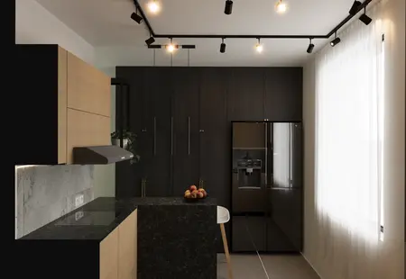 Kuchnia w stylu industrialnym z drewnianymi meblami i minimalistycznym wykończeniem.