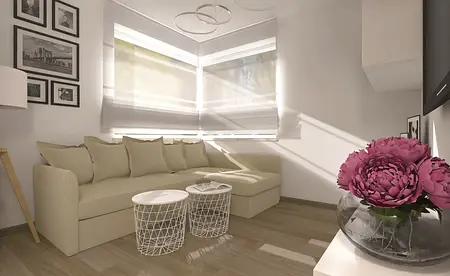 Wnętrze salonu w stylu skandynawskim z beżową sofą i białymi dodatkami.