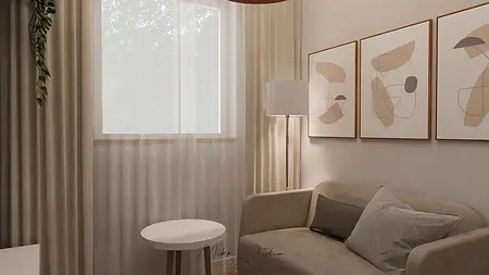 Współczesny salon z beżową sofą, lampą i obrazami.