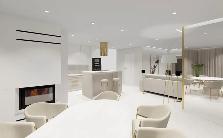 Wnętrze nowoczesnej kuchni z białymi meblami, złotymi dodatkami i eleganckim oświetleniem.