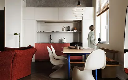 Kuchnia w stylu eklektycznym z czerwonymi akcentami i minimalistycznym wyposażeniem.