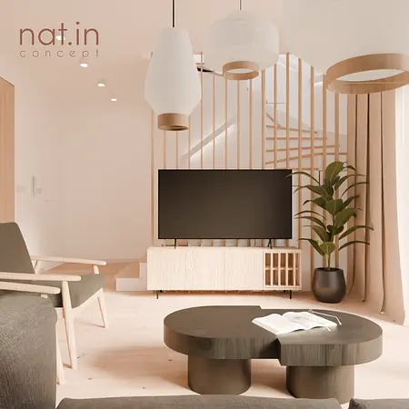 Wnętrze salonu w stylu japandi z telewizorem i rośliną.