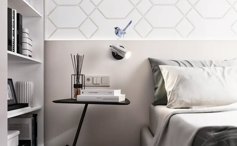Wnętrze sypialni w stylu nowoczesnym z minimalistycznymi meblami i delikatnymi akcentami.