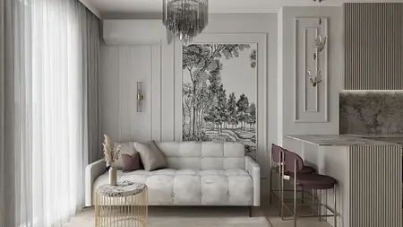 Wnętrze salonu w stylu glamour z białą sofą i szarymi dodatkami.