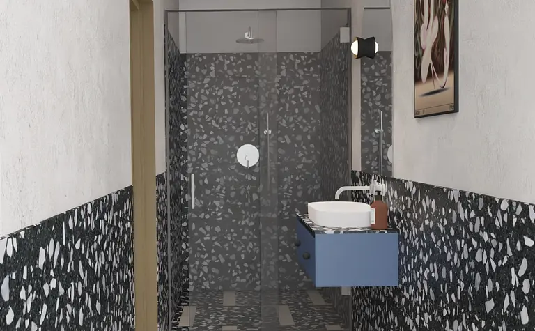 Nowoczesna łazienka w stylu art deco i industrialnym z niebieską szafką i przeszklonym prysznicem.