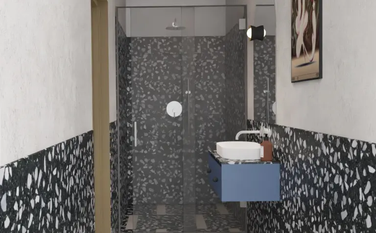 Nowoczesna łazienka w stylu art deco i industrialnym z niebieską szafką i przeszklonym prysznicem.