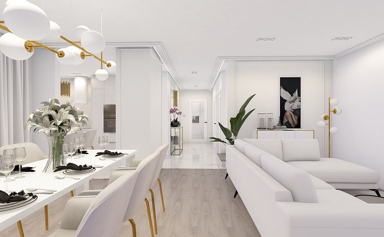 Wnętrze salonu z białą sofą, eleganckim oświetleniem i roślinami.