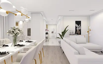 Wnętrze salonu z białą sofą, eleganckim oświetleniem i roślinami.