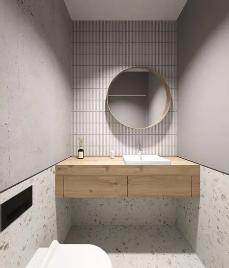 Minimalistyczna łazienka z drewnianą umywalką i okrągłym lustrem w nowoczesnym stylu.