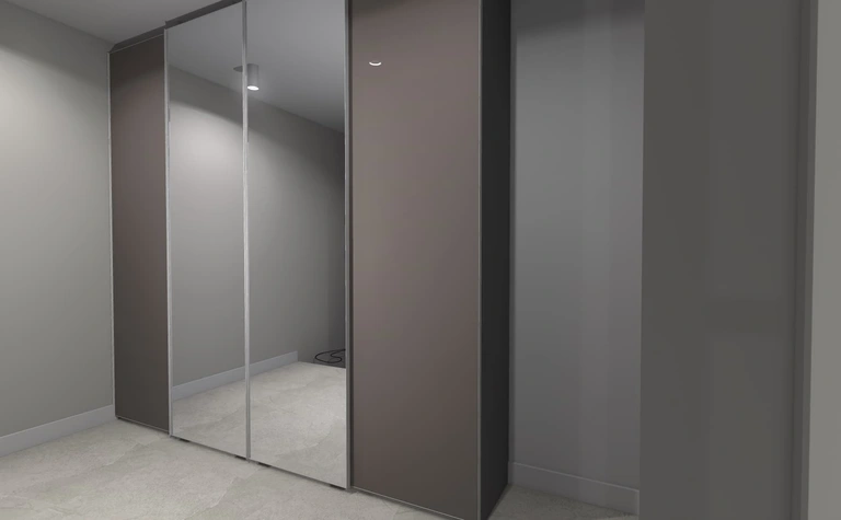 Garderoba z lustrzanymi drzwiami i szarymi ścianami w stylu japandi i minimalistycznym.