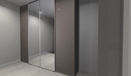 Garderoba z lustrzanymi drzwiami i szarymi ścianami w stylu japandi i minimalistycznym.