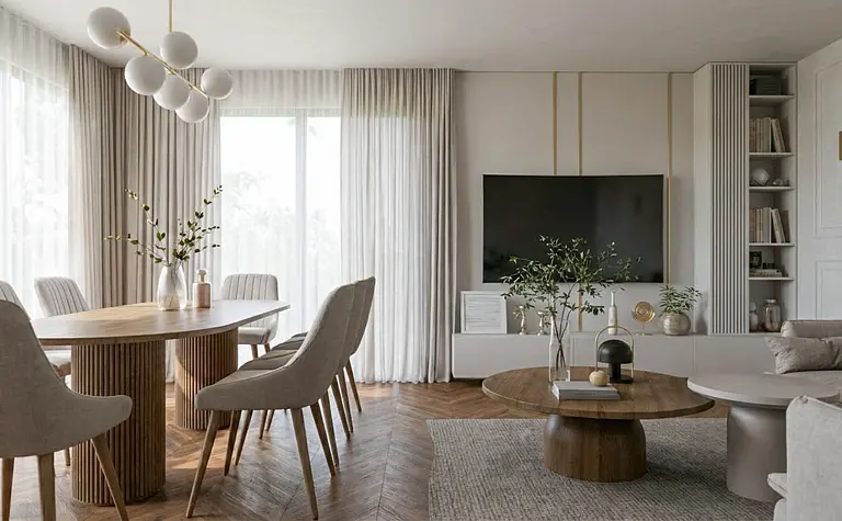 Wnętrze jadalni z okrągłym stołem, szarymi krzesłami i nowoczesnym oświetleniem.