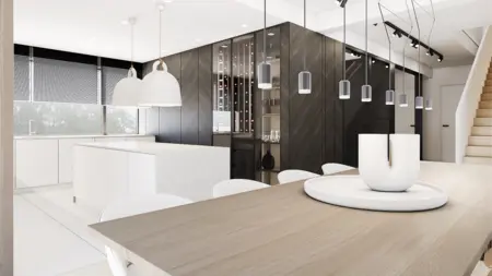 Wnętrze kuchni w stylu minimalistycznym z białymi meblami i czarnymi detalami.