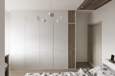 Garderoba w stylach industrialnym, japandi i minimalistycznym z białymi meblami.