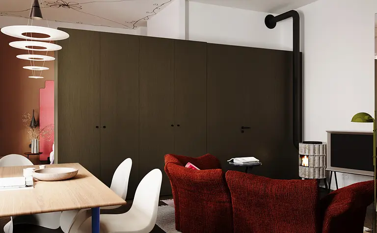 Salon w stylu eklektycznym z czerwonymi sofami i drewnianym stołem, industrialnymi akcentami.