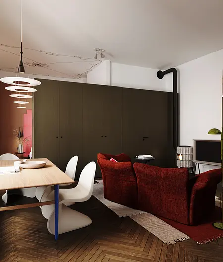 Salon w stylu eklektycznym z czerwonymi sofami i drewnianym stołem, industrialnymi akcentami.