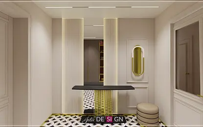 Przedpokój w stylu art deco z czarnym stolikiem i złotymi akcentami.