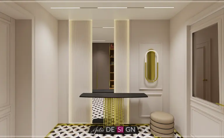 Przedpokój w stylu art deco z czarnym stolikiem i złotymi akcentami.