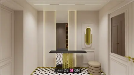 Przedpokój w stylu art deco z czarnym stolikiem i złotymi akcentami.