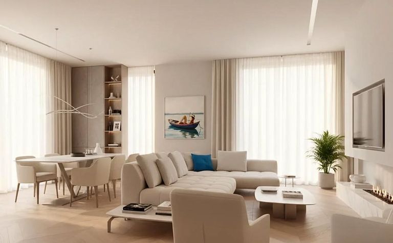 Wnętrze salonu w stylu minimalistycznym z jasnymi meblami i dużymi oknami.