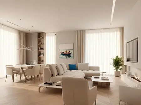 Wnętrze salonu w stylu minimalistycznym z jasnymi meblami i dużymi oknami.