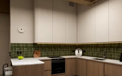 Wnętrze kuchni z drewnianymi meblami i zielonymi kaflami, styl vintage.