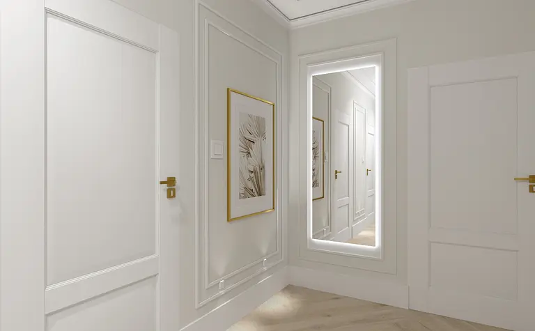 Przedpokój z białymi ścianami, lustrem i złotymi akcentami, styl glamour.