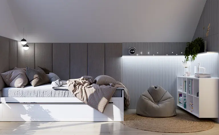 Wnętrze poddasza z białym łóżkiem, szarymi dodatkami i boho akcentami.