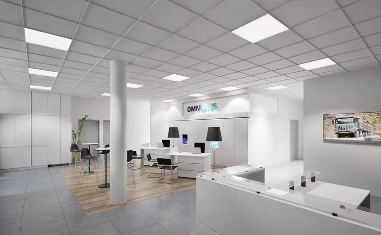 Wnętrze biura z białymi meblami, industrialnymi akcentami i nowoczesnym designem.