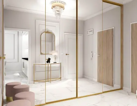 Przedpokój w stylu glamour z dużym lustrem i eleganckimi detalami.