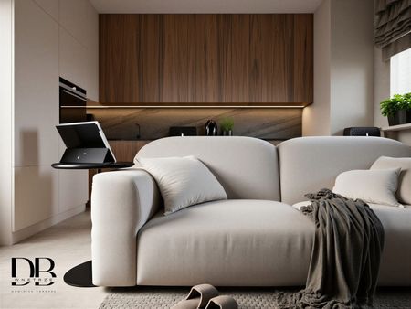 Wnętrze kuchni w stylu japandi i minimalistycznym z beżową sofą.