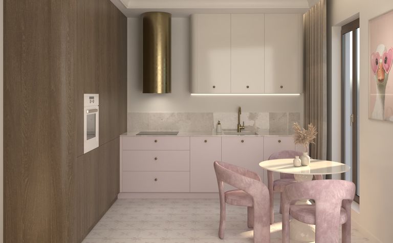 Wnętrze kuchni minimalistycznej z różowymi meblami i drewnianymi detalami.