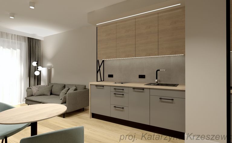 Wnętrze kuchni w stylu industrialnym i minimalistycznym z szarymi meblami i drewnem.