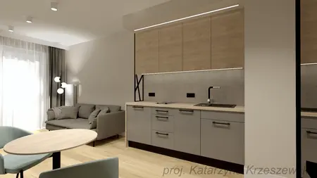 Wnętrze kuchni w stylu industrialnym i minimalistycznym z szarymi meblami i drewnem.