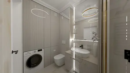 Wnętrze łazienki z elementami art deco i glamour, beżowe meble, nowoczesne oświetlenie.