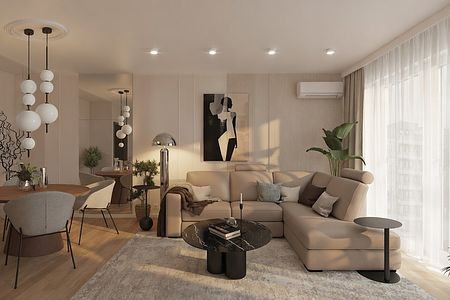 Wnętrze salonu z jasnymi meblami, nowoczesnymi lampami i roślinami.