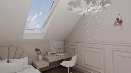 Wnętrze poddasza z minimalistycznym biurkiem i lampą