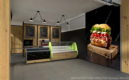 Wnętrze lokalu gastronomicznego z drewnianymi elementami i zielonymi akcentami.