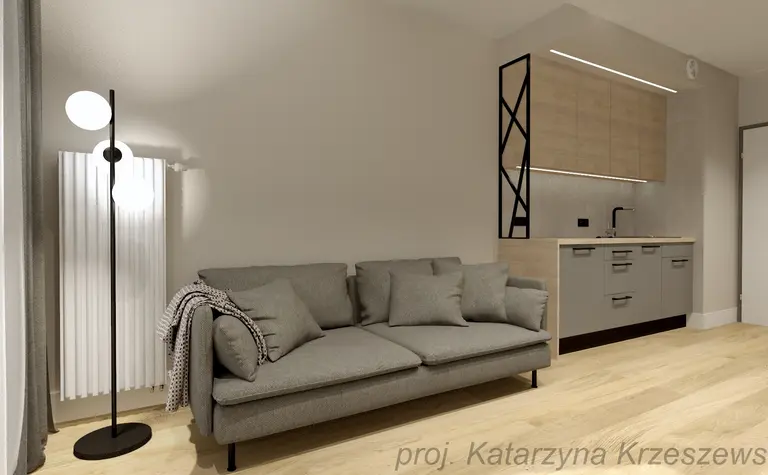 Wnętrze z szarym sofą, drewnianą kuchnią i lampą w stylu industrialnym, minimalistycznym i współczesnym.