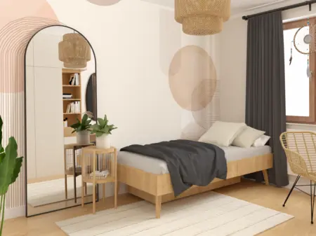 Sypialnia w stylu boho z naturalnymi materiałami i dużym lustrem.