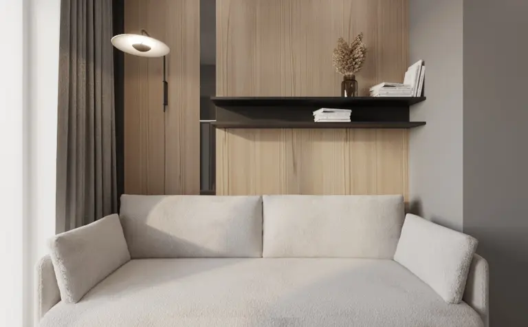 Nowoczesny salon w stylu glamour z jasną sofą i drewnianymi akcentami.