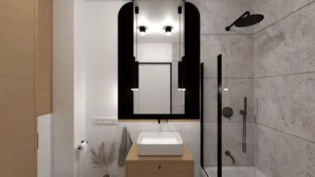 Wnętrze łazienki w stylu industrialnym i skandynawskim z drewnianą szafką i nowoczesnymi lampami.