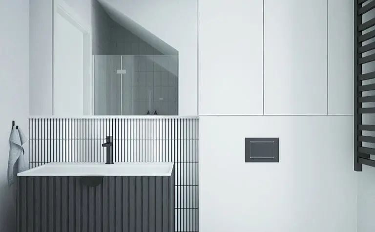 Nowoczesna łazienka z minimalistycznym designem, białą umywalką i szarym wykończeniem.