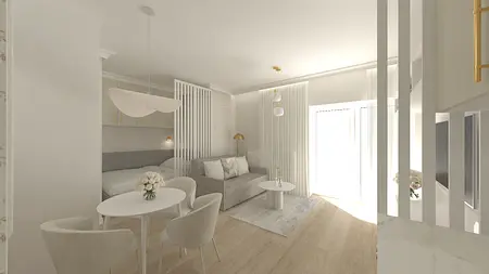 Eklektyczne wnętrze z szarym narożnikiem, białym stołem i jasnymi zasłonami.