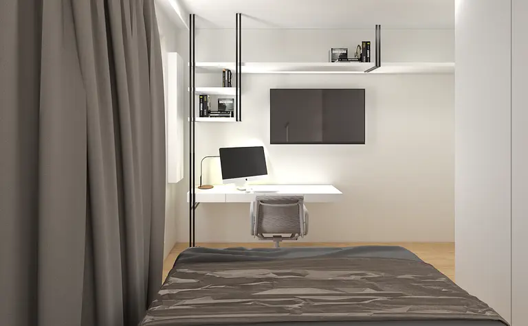 Wnętrze minimalistycznego pokoju z biurkiem, szaro-białymi ścianami i półkami.
